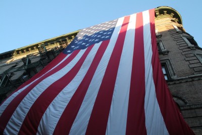 unfurling flag photo at 9/11 volunteers photo Mary Perillo